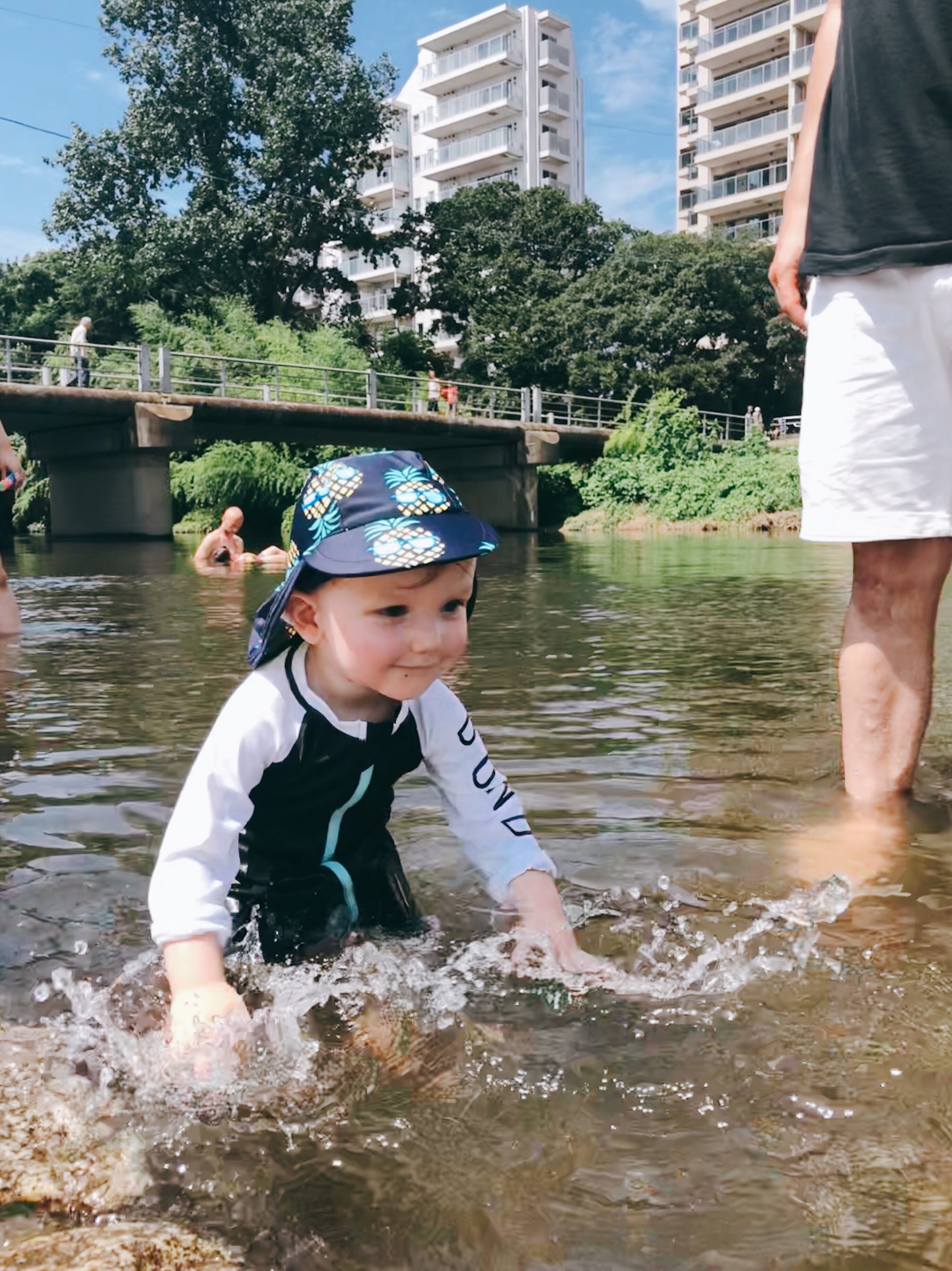 toddler splashing in river