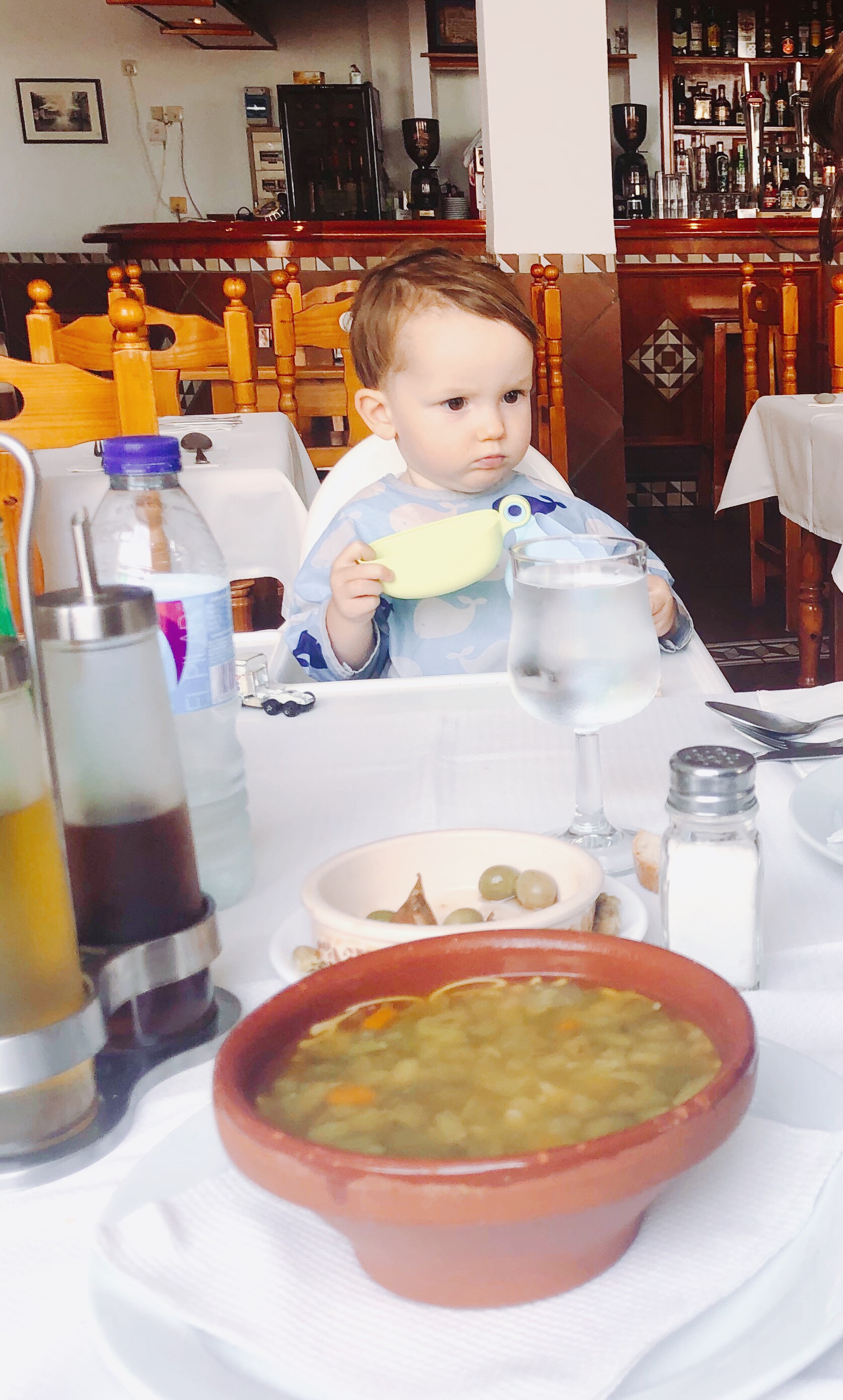 child eating olives
